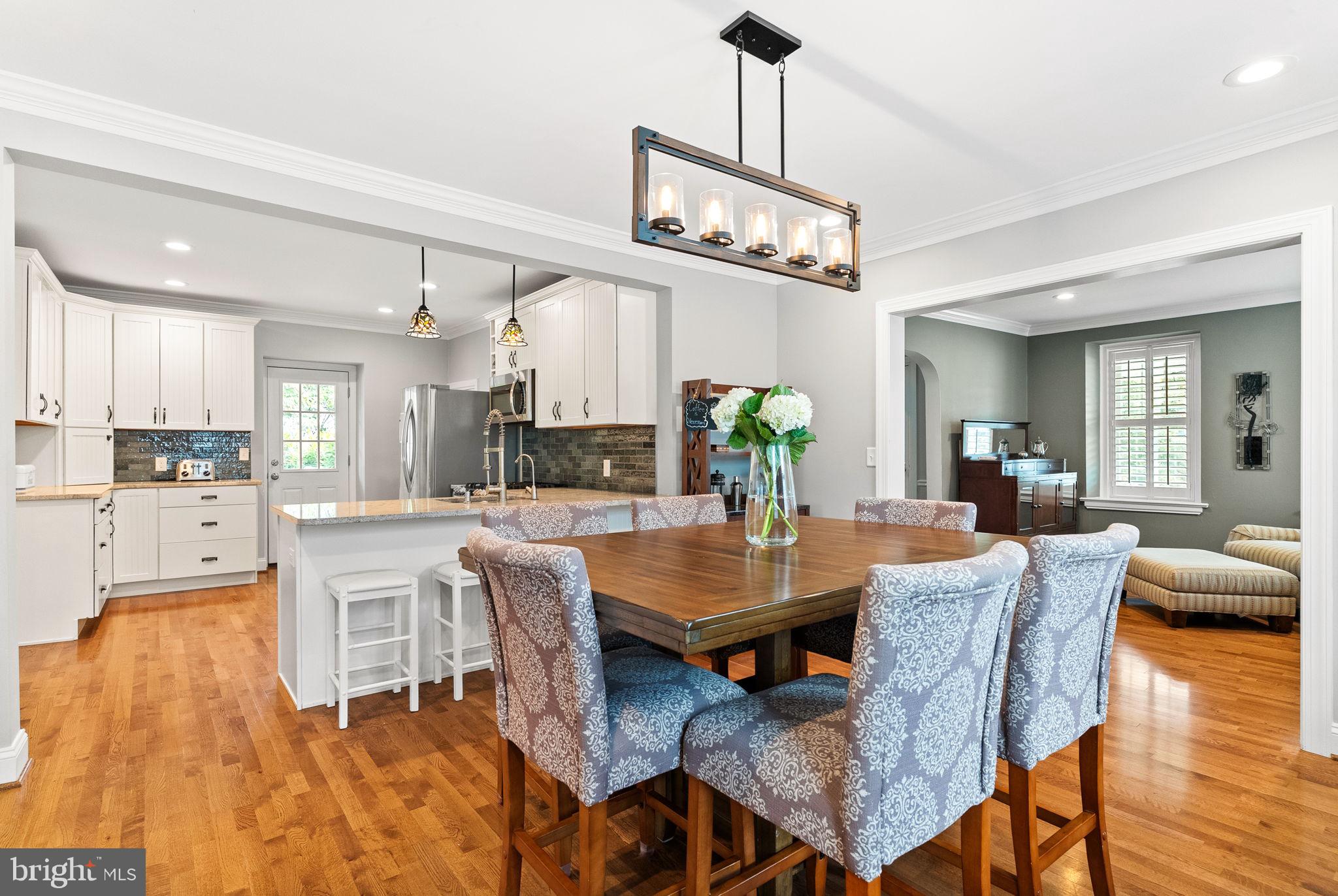 337 Old Lancaster Road Devon, PA 19333 - Photo 19 of 56 a view of a dining room with furniture wooden floor and chandelier