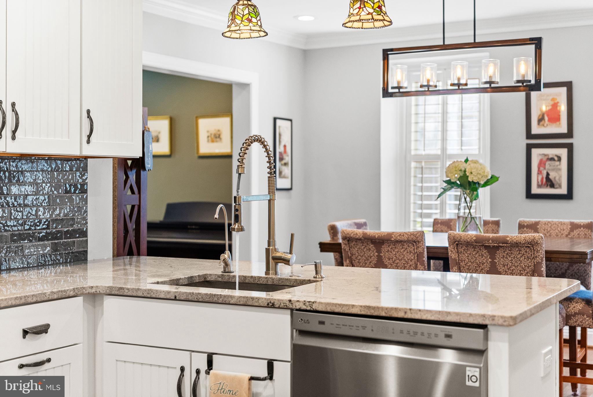 337 Old Lancaster Road Devon, PA 19333 - Photo 22 of 56 a kitchen with stainless steel appliances granite countertop a sink and a stove
