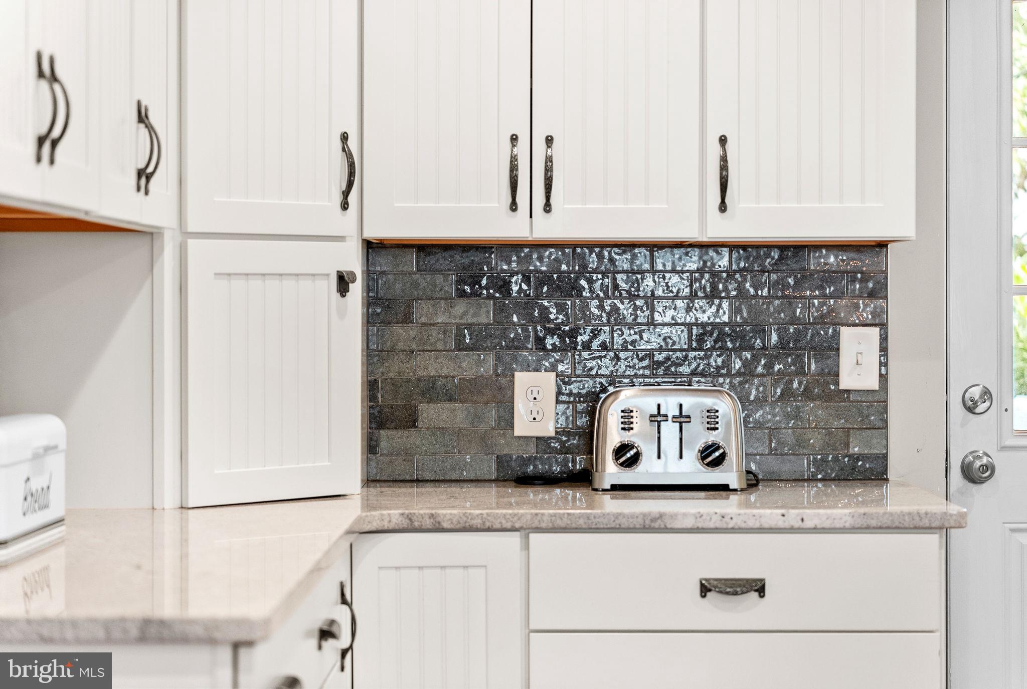 337 Old Lancaster Road Devon, PA 19333 - Photo 24 of 56 a kitchen with granite countertop white cabinets and a stainless steel appliances