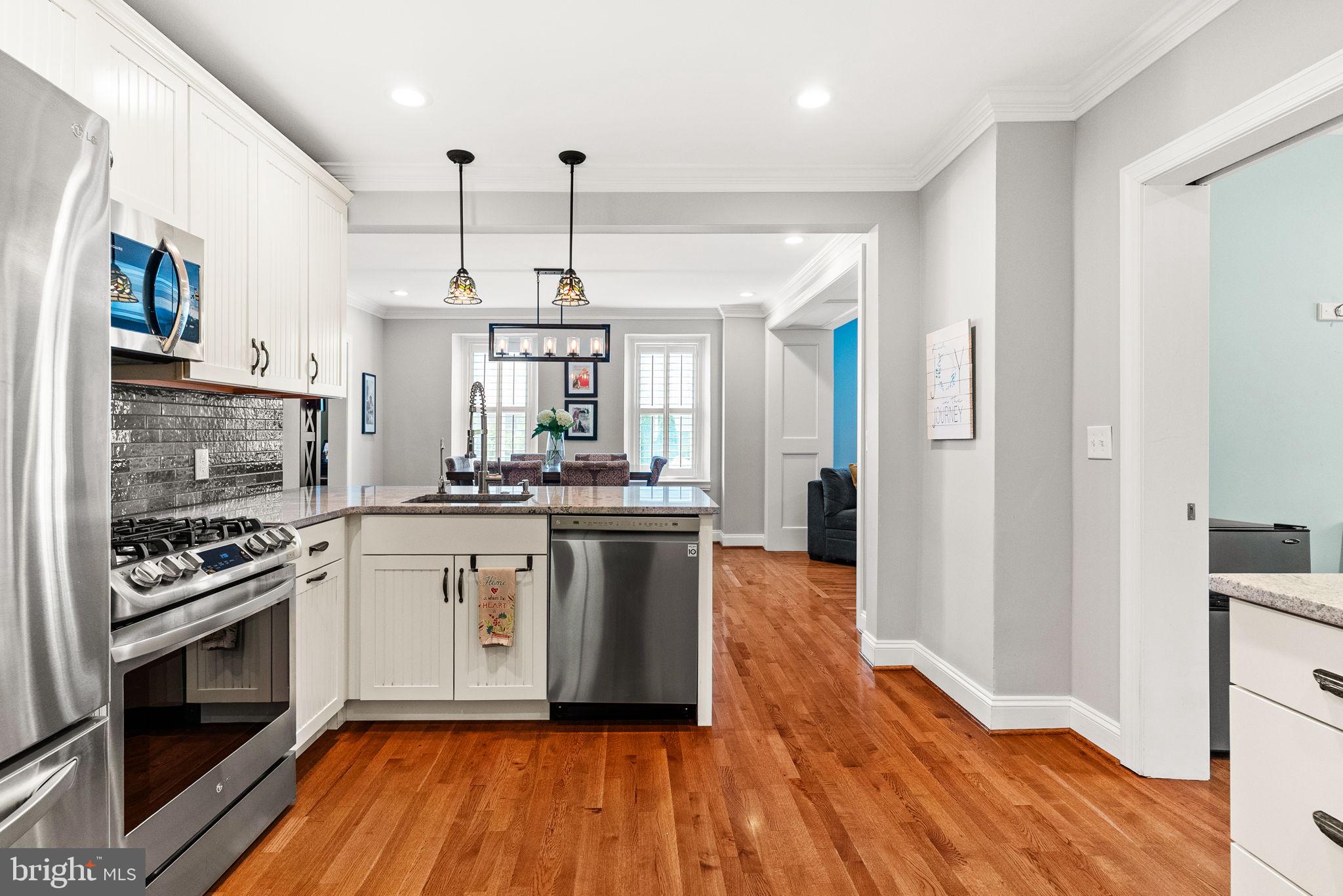 337 Old Lancaster Road Devon, PA 19333 - Photo 26 of 56 a kitchen with stainless steel appliances granite countertop a stove and cabinets