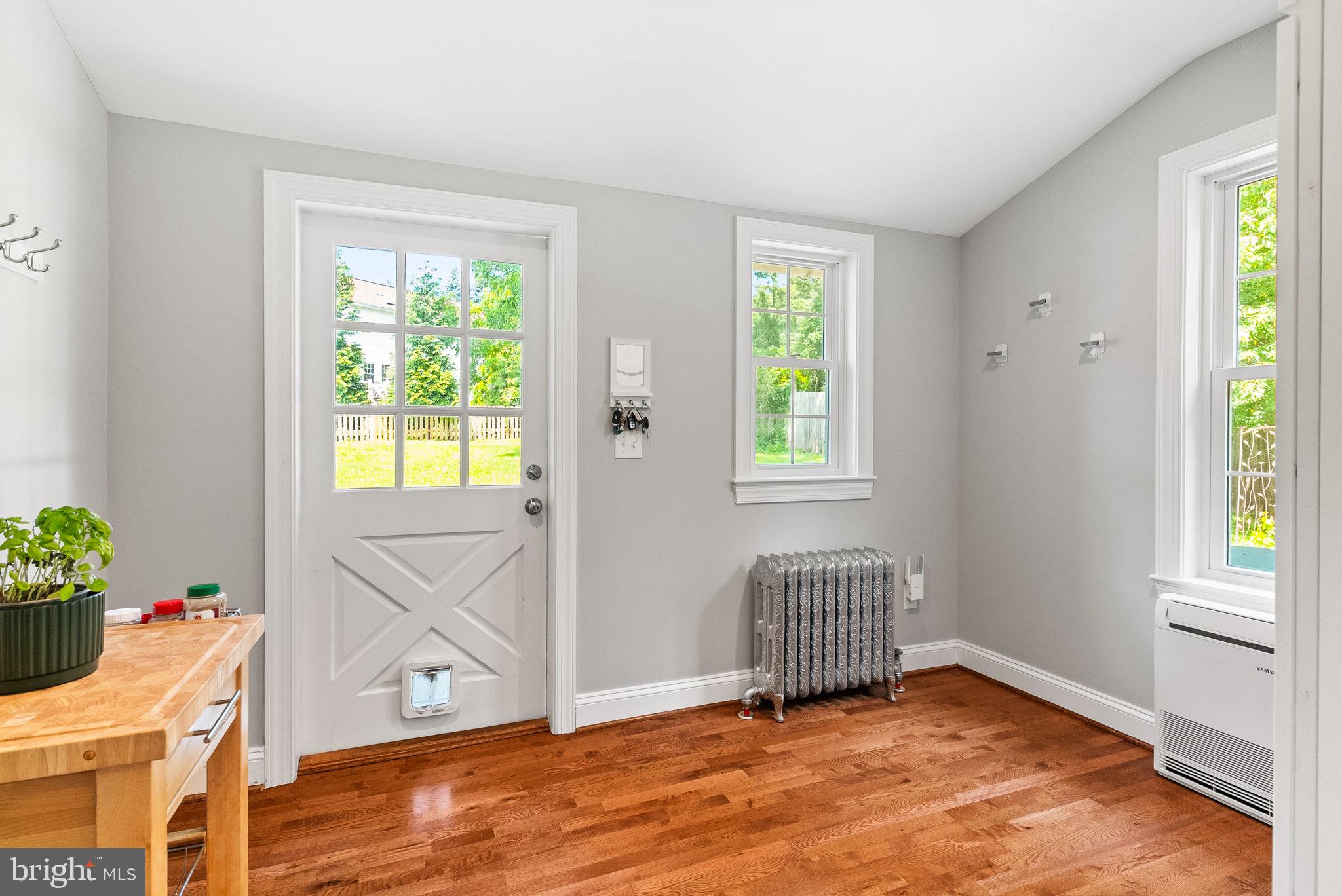 337 Old Lancaster Road Devon, PA 19333 - Photo 27 of 56 a view of an empty room with a window and wooden floor