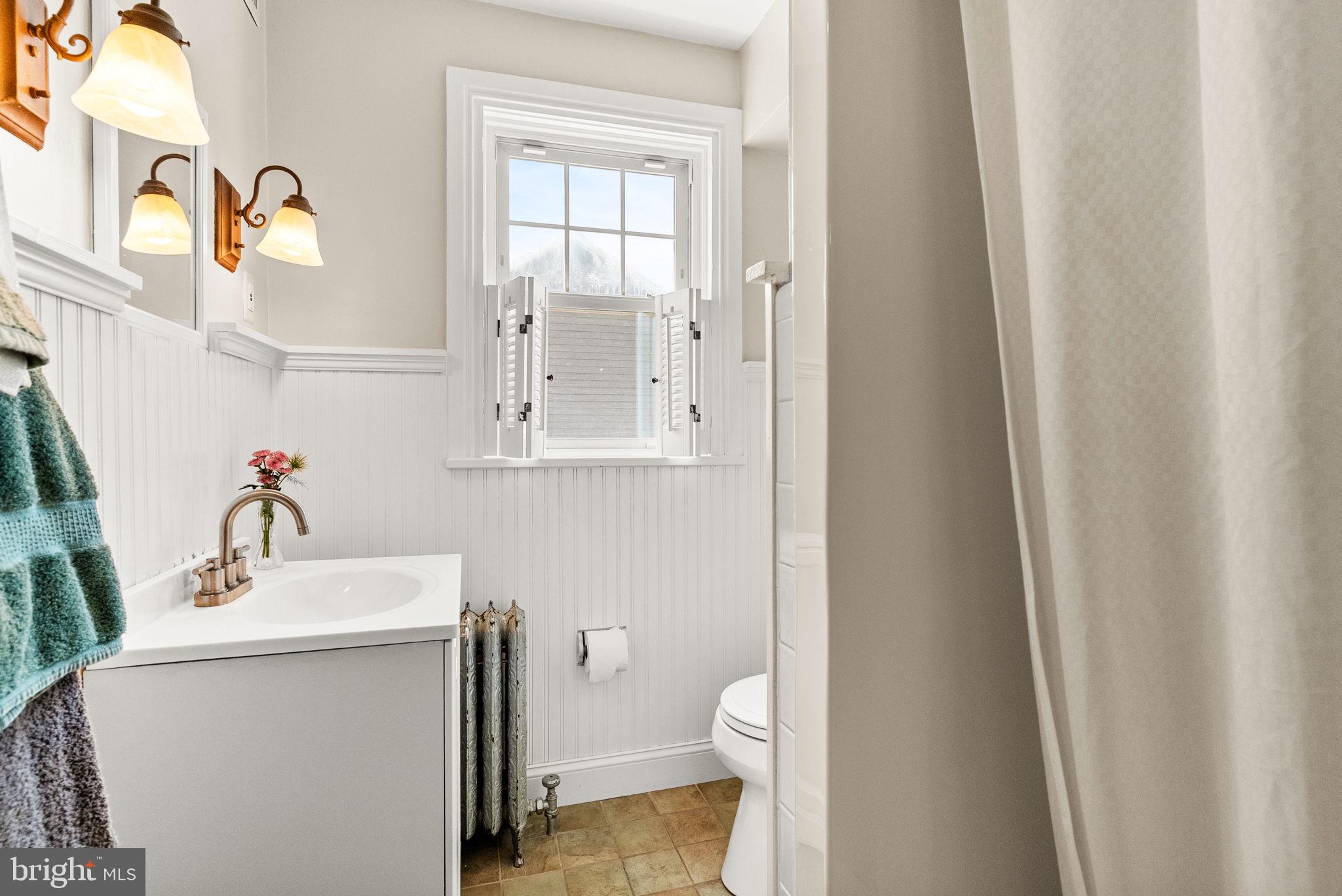 337 Old Lancaster Road Devon, PA 19333 - Photo 32 of 56 a bathroom with a sink vanity mirror and toilet