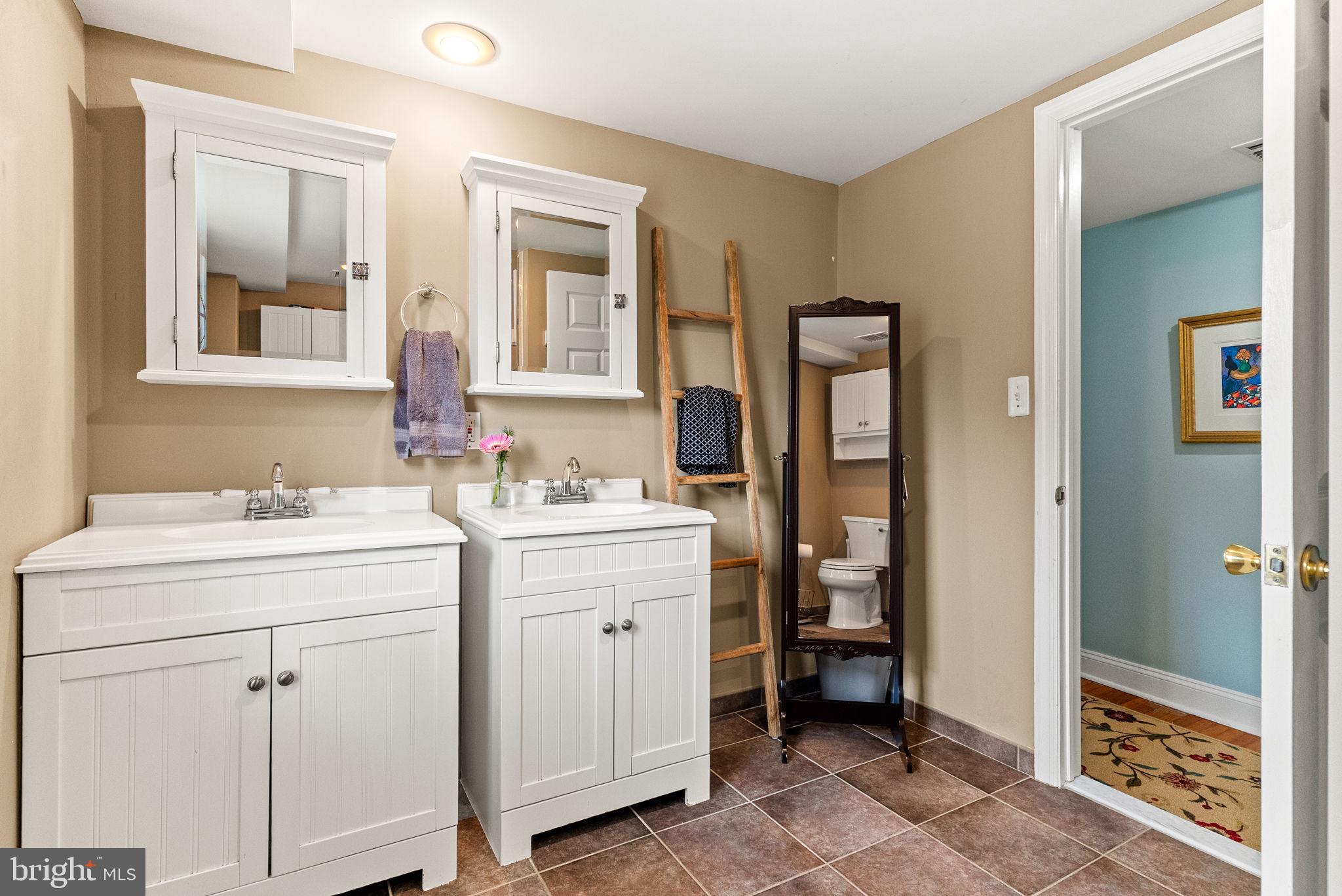 337 Old Lancaster Road Devon, PA 19333 - Photo 36 of 56 a bathroom with a sink a toilet and shower