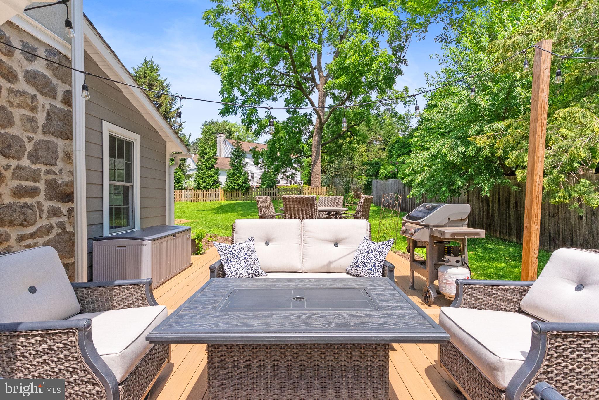 337 Old Lancaster Road Devon, PA 19333 - Photo 49 of 56 a view of a patio with couches table and chairs and a barbeque