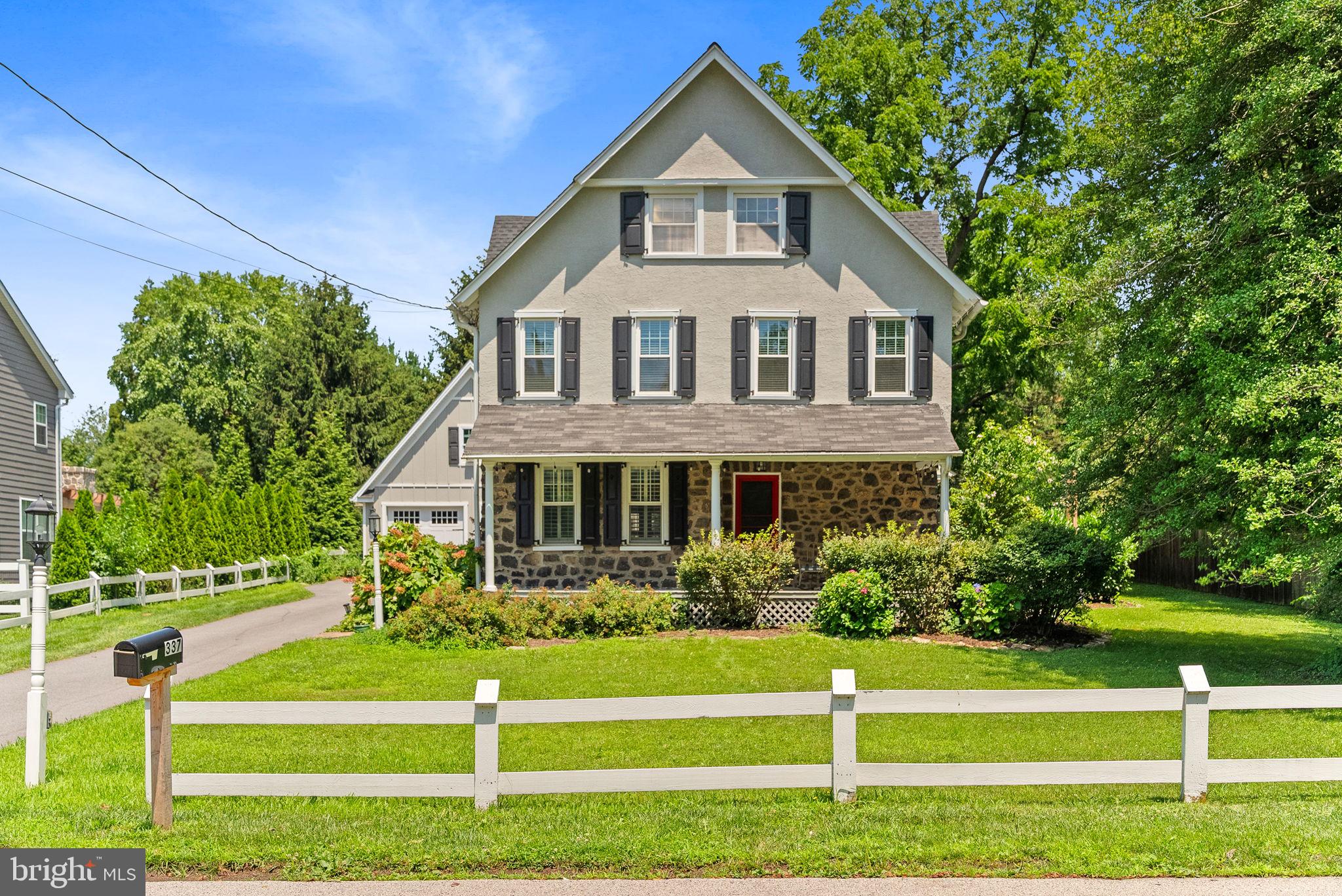 337 Old Lancaster Road Devon, PA 19333 - Photo 5 of 56 a front view of a house with a yard