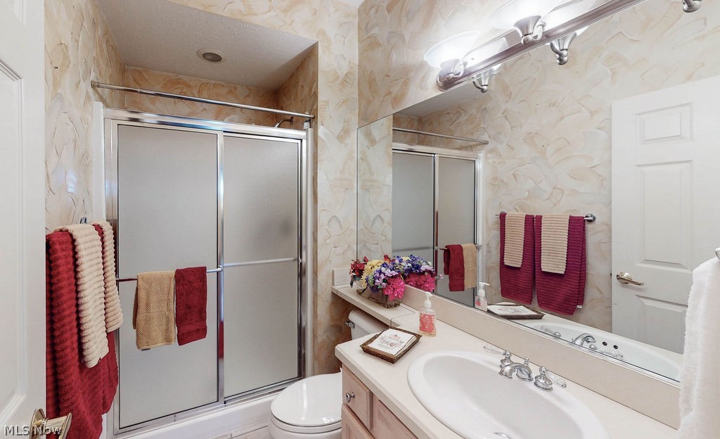 36845 Aberdeen Lane Solon, OH 44139 - Photo 15 of 24 Full bathroom with vanity and a shower stall