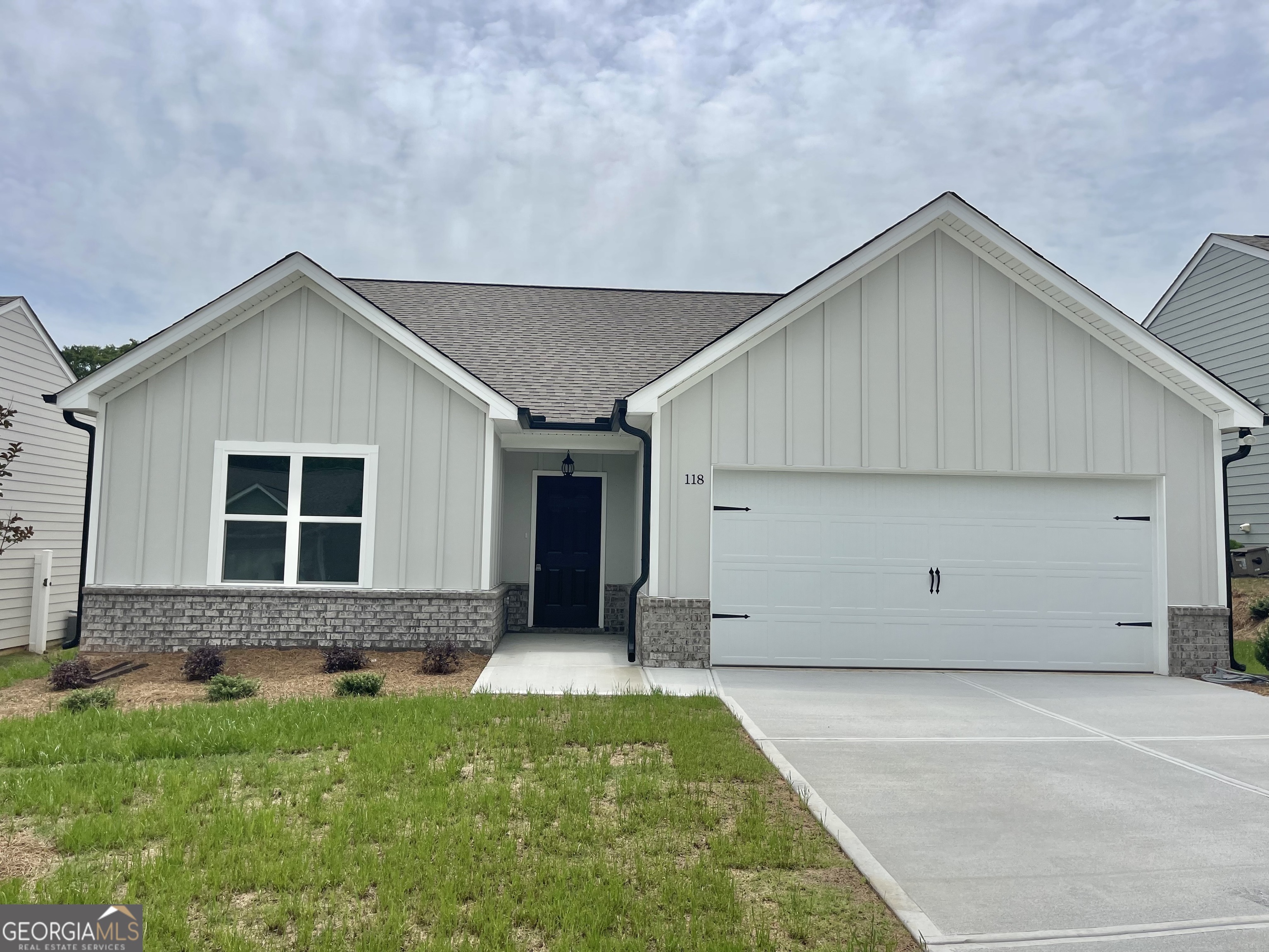 118 CHARLESTON Lane Milner, GA 30257 - Photo 1 of 21 a view of a house with a yard