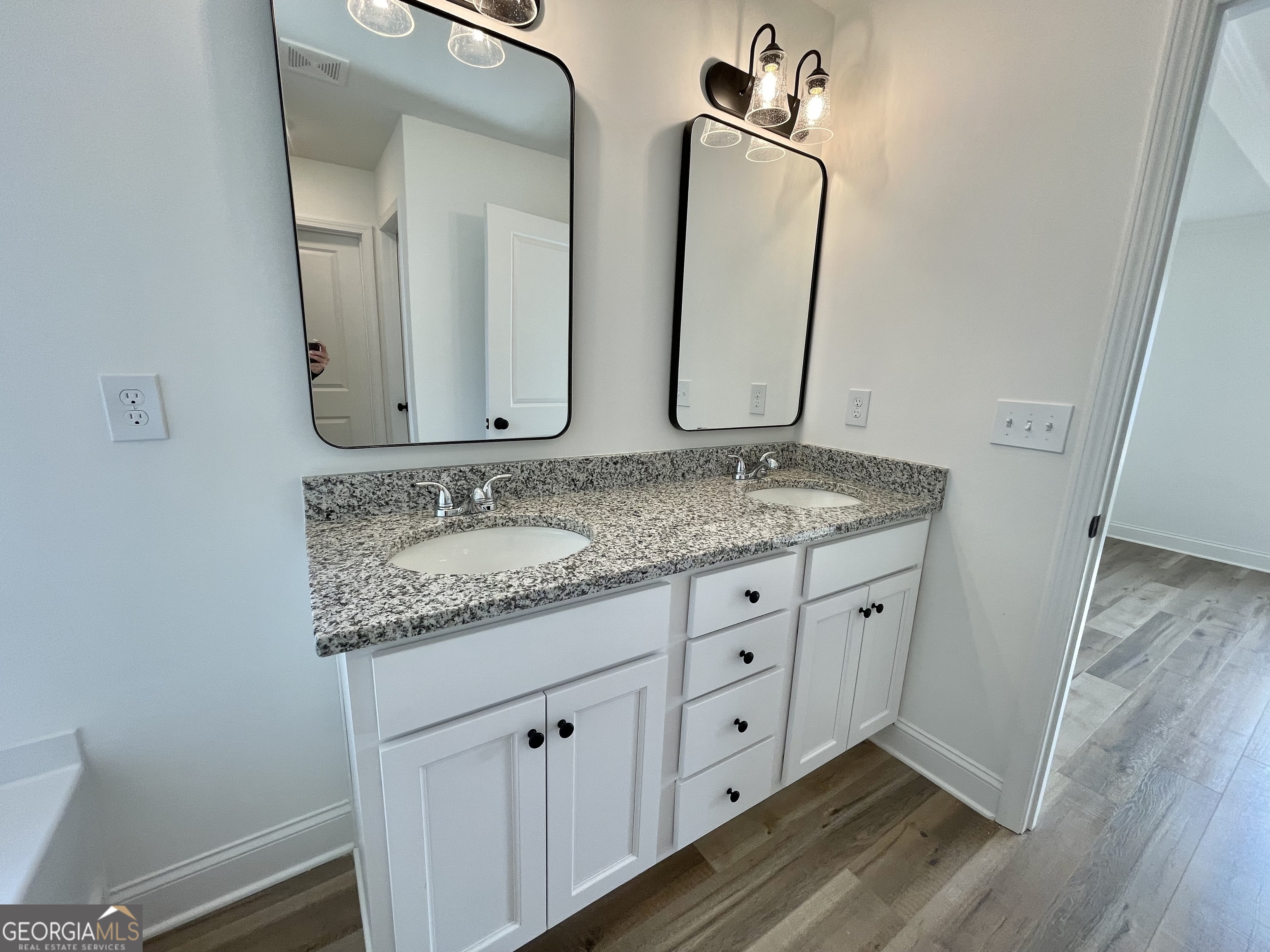 118 CHARLESTON Lane Milner, GA 30257 - Photo 13 of 21 a bathroom with a granite countertop double vanity sink and mirror