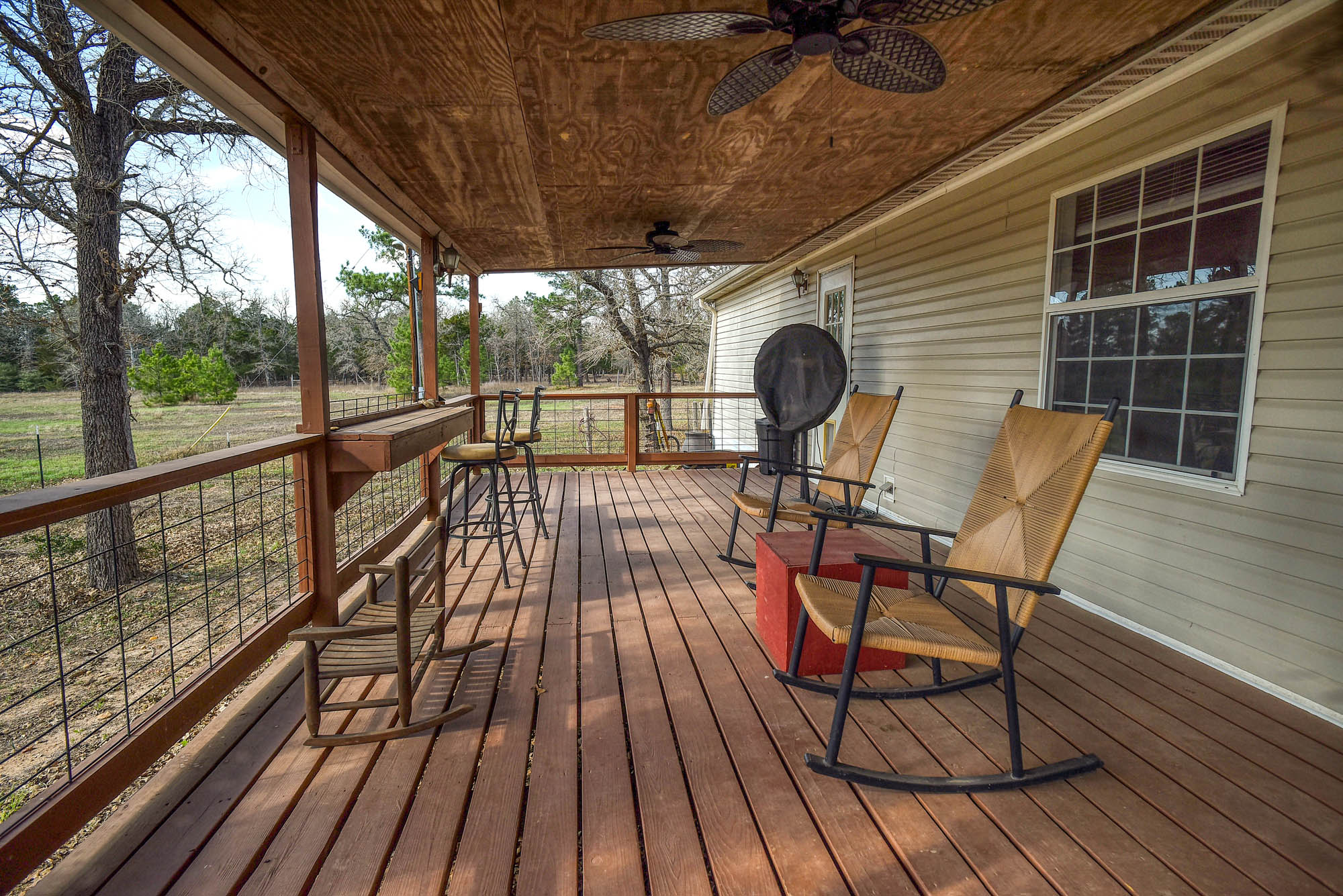 552 South Old Potato Road Paige, TX 78659 - Photo 32 of 40 Sunsets seem a bit more spectacular from this huge back deck.