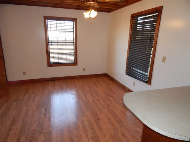 a kitchen with stainless steel appliances granite countertop a refrigerator a sink and wooden cabinets