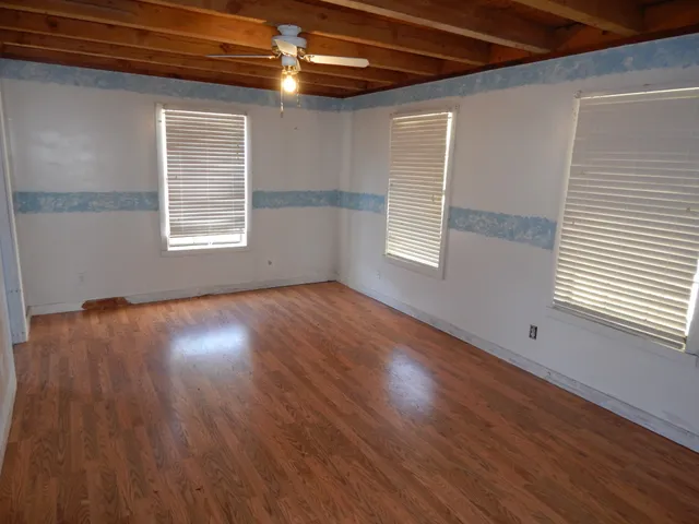wooden floor and windows in a room