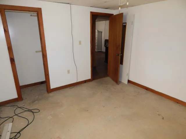 a bathroom with a toilet and a bathtub