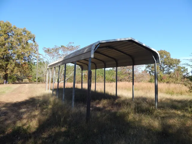 a view of a swimming pool with a yard