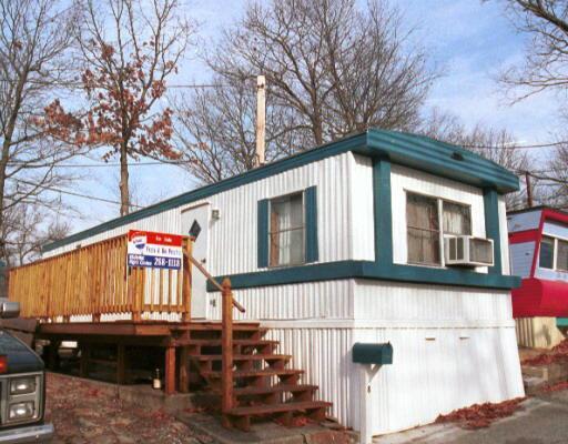 a view of a building with a large tree