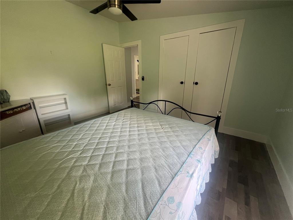 5855 Jack Brack Road St. Cloud, FL 34771 - Photo 65 of 86 a bedroom with a bed and dresser