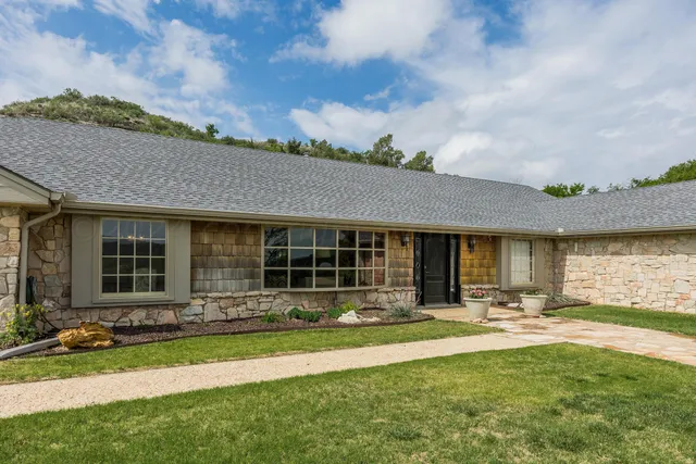 front view of a house with a yard