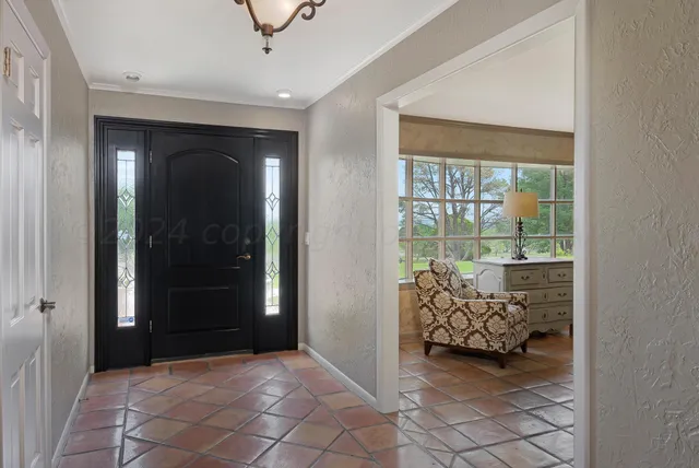 a view of livingroom with furniture and windows
