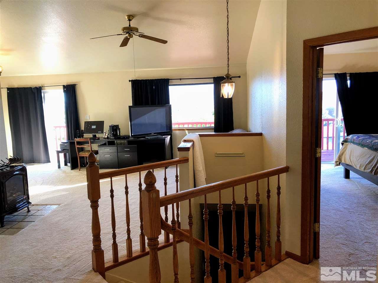 602 Talus Way Reno, NV 89503 - Photo 2 of 25 a view of staircase and living room with wooden floor