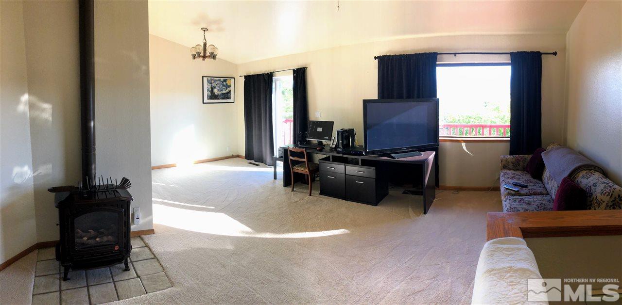 602 Talus Way Reno, NV 89503 - Photo 3 of 25 a view of a livingroom with furniture and a flat screen tv