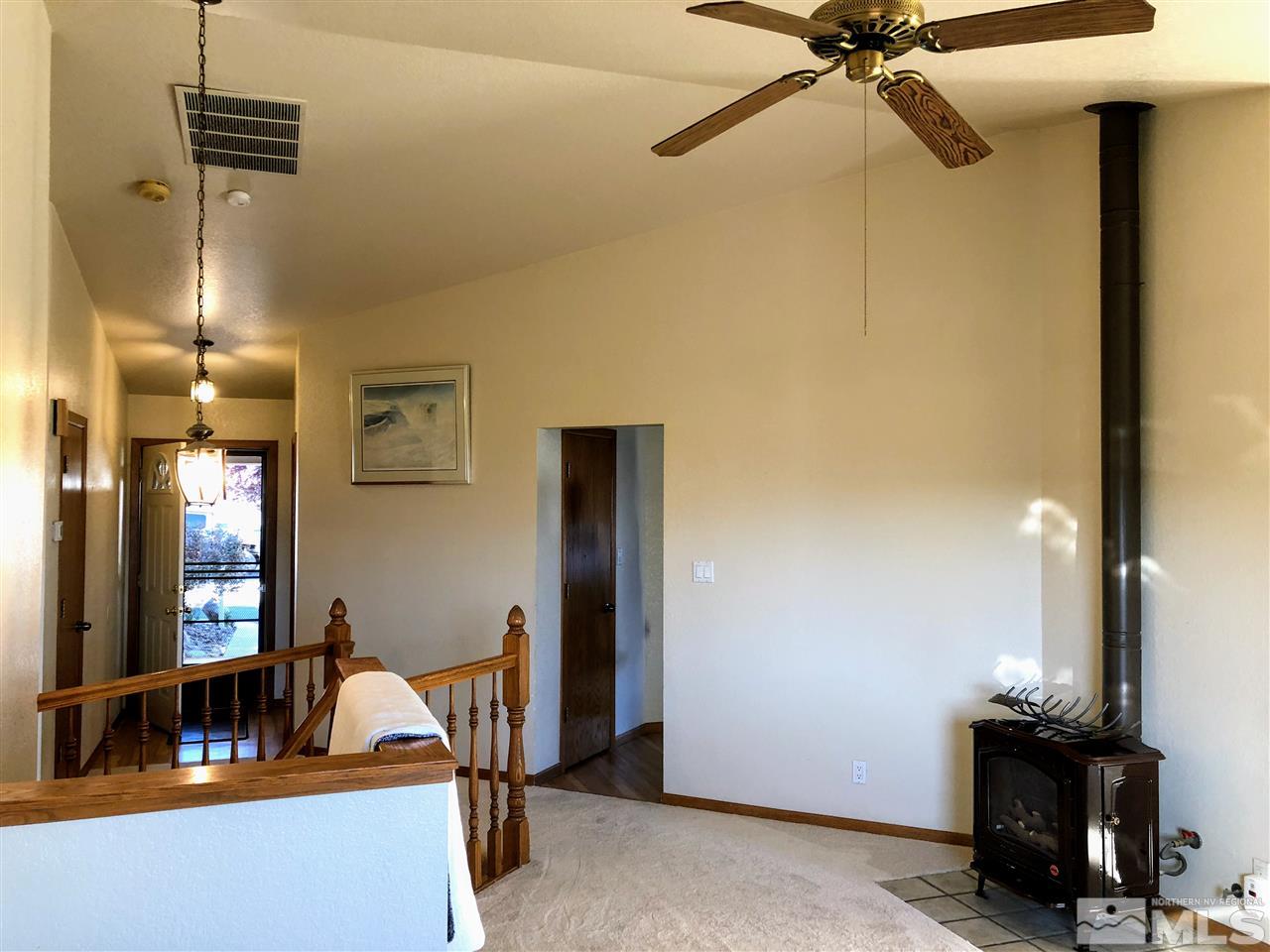 602 Talus Way Reno, NV 89503 - Photo 4 of 25 a view of a room with a mirror and furniture