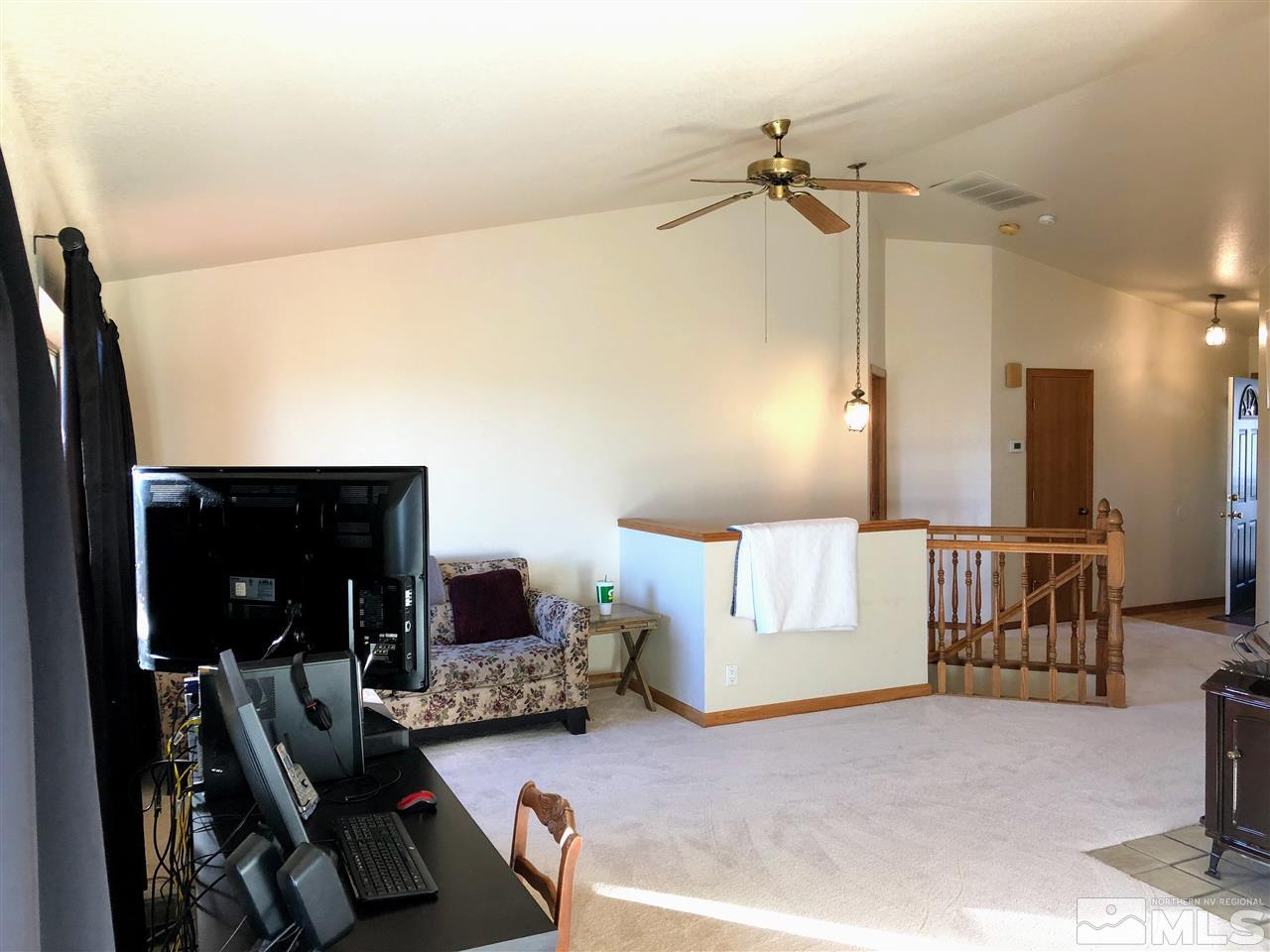 602 Talus Way Reno, NV 89503 - Photo 5 of 25 a view of a livingroom with furniture and a ceiling fan