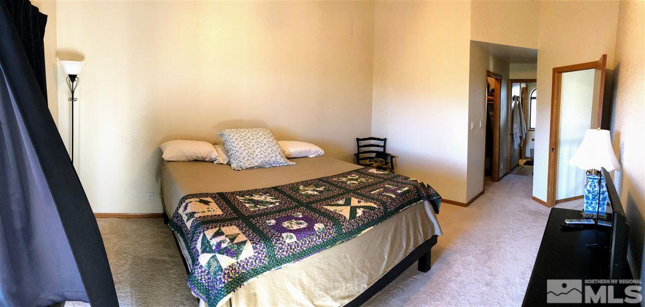 602 Talus Way Reno, NV 89503 - Photo 6 of 25 a bedroom with a bed and wooden floor