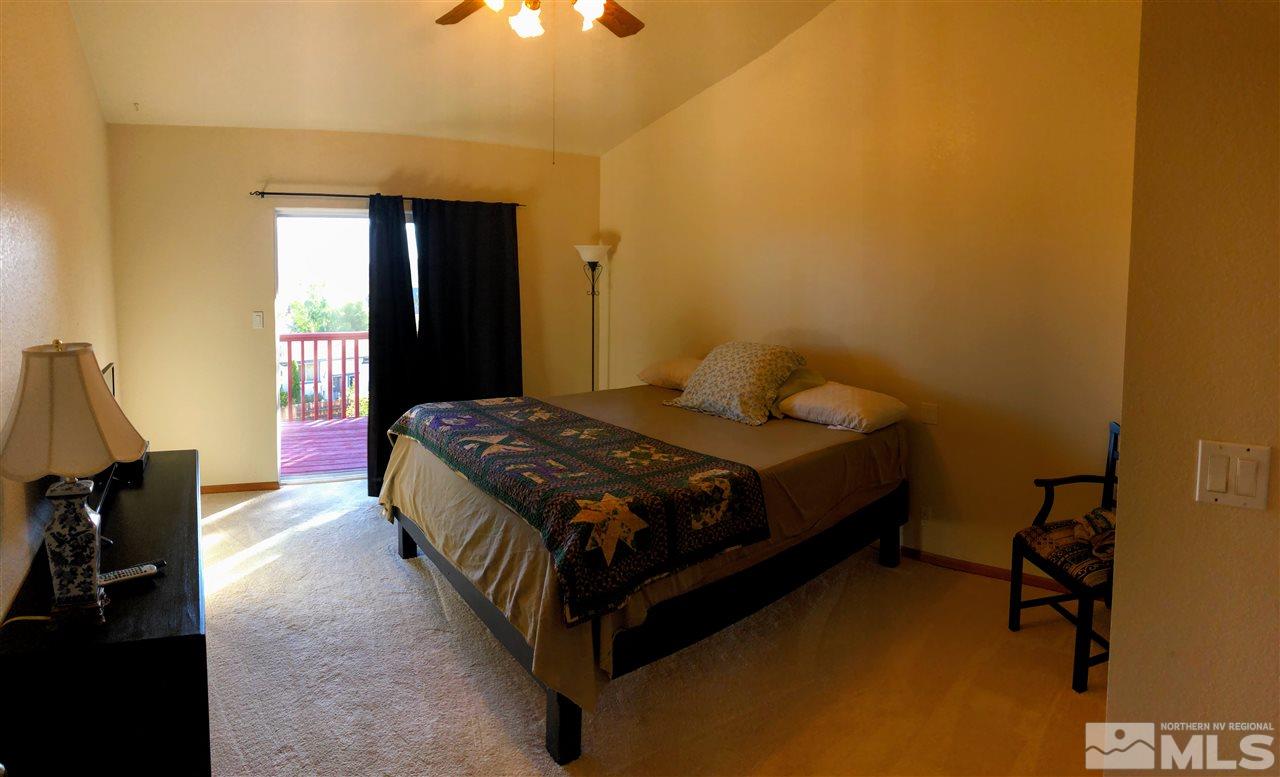 602 Talus Way Reno, NV 89503 - Photo 7 of 25 a bedroom with a bed and wooden floor