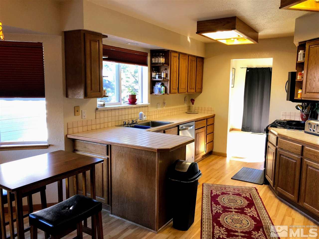 602 Talus Way Reno, NV 89503 - Photo 9 of 25 a kitchen with a stove and a sink
