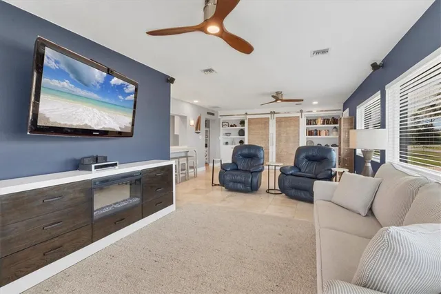 a bathroom with a granite countertop sink vanity mirror bathtub shower and a toilet