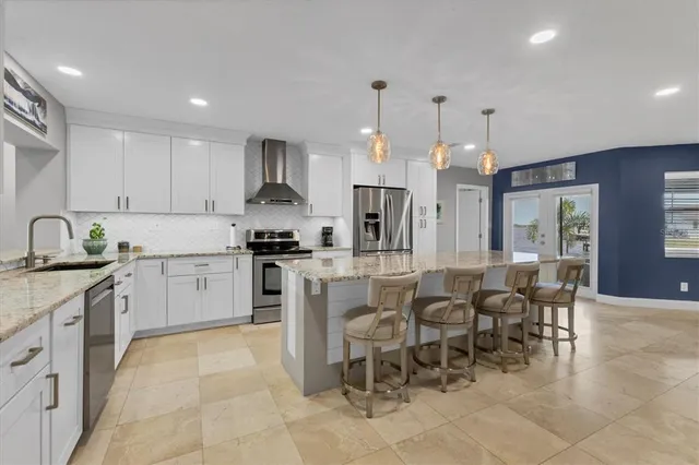 a view of a dining room with furniture and a window