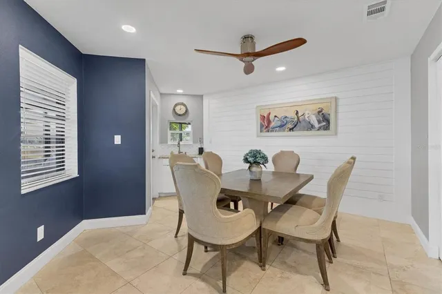 a spacious bedroom with a bed and a couch