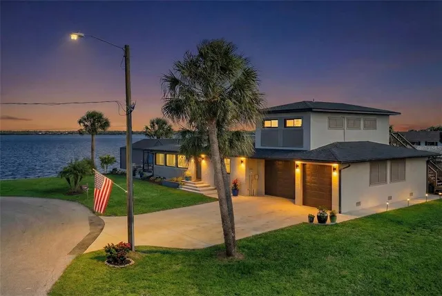 a aerial view of a house with a swimming pool
