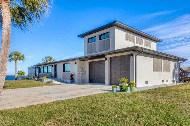 a front view of house with yard outdoor seating and barbeque oven