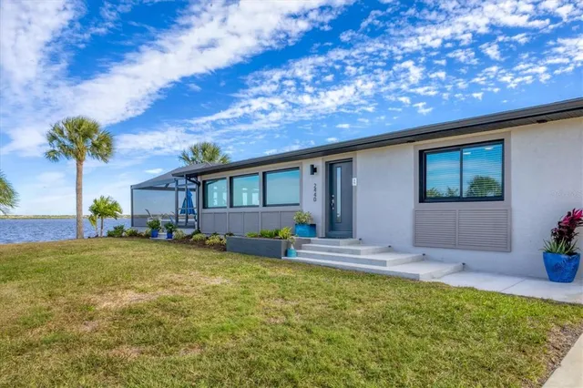 a view of a dining room with furniture and a window