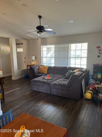 a living room with furniture and a table