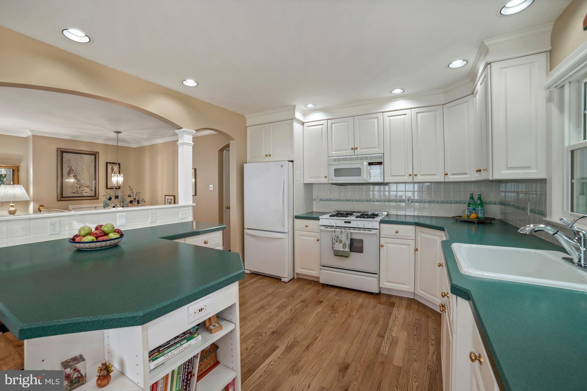 217 Rolling Road Gaithersburg, MD 20877 - Photo 11 of 38 Kitchen with recessed lighting and hardwood floors