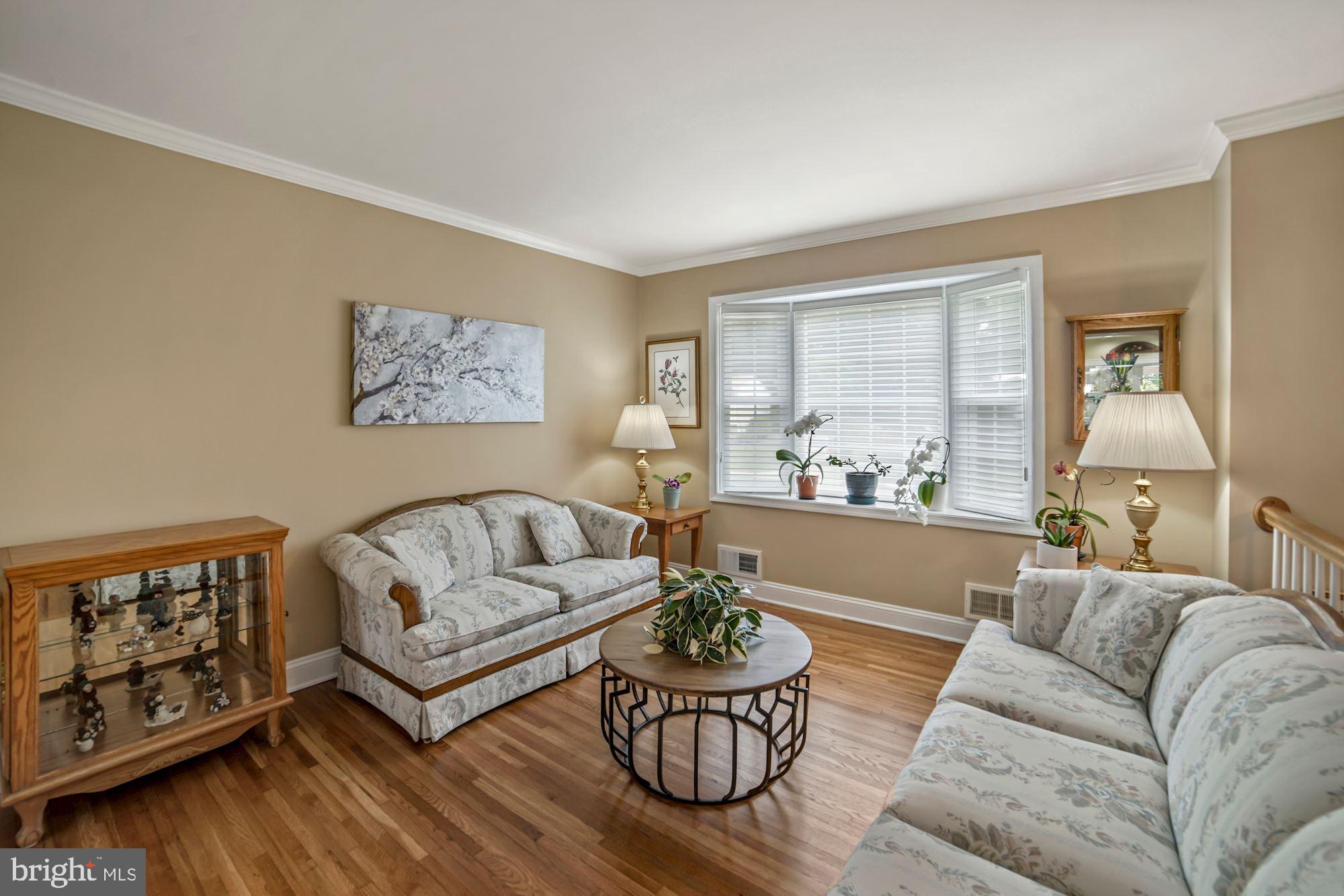 Living Room with new bay window with custom shade