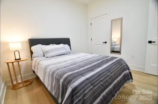 a bedroom with a bed and closet