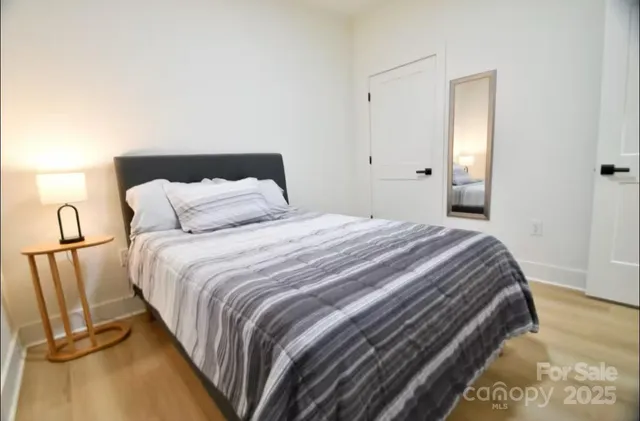 a bedroom with a bed and closet