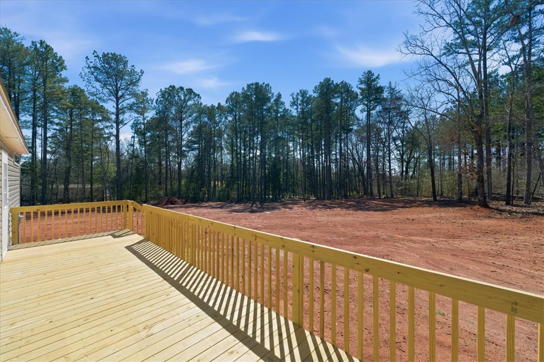 205 Union Court West Union, SC 29696 - Photo 27 of 28 This spacious deck offers a serene view and level outdoor living space.