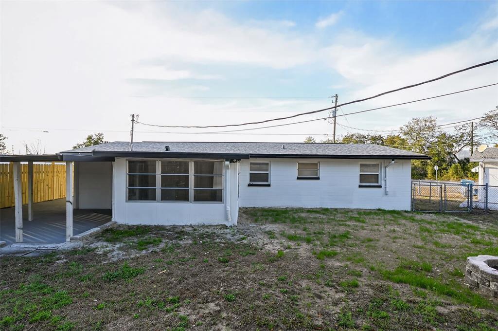 4086 Arrowhead Avenue Spring Hill, FL 34606 - Photo 19 of 21 a view of a house with a yard