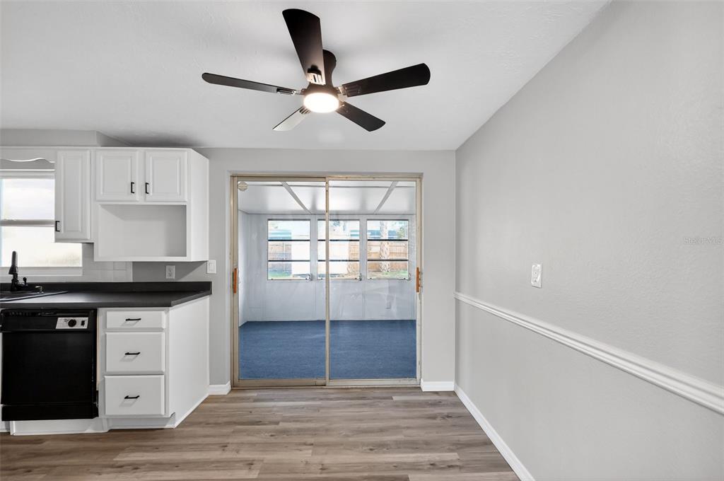 4086 Arrowhead Avenue Spring Hill, FL 34606 - Photo 9 of 21 a kitchen with granite countertop a sink cabinets stainless steel appliances and a window