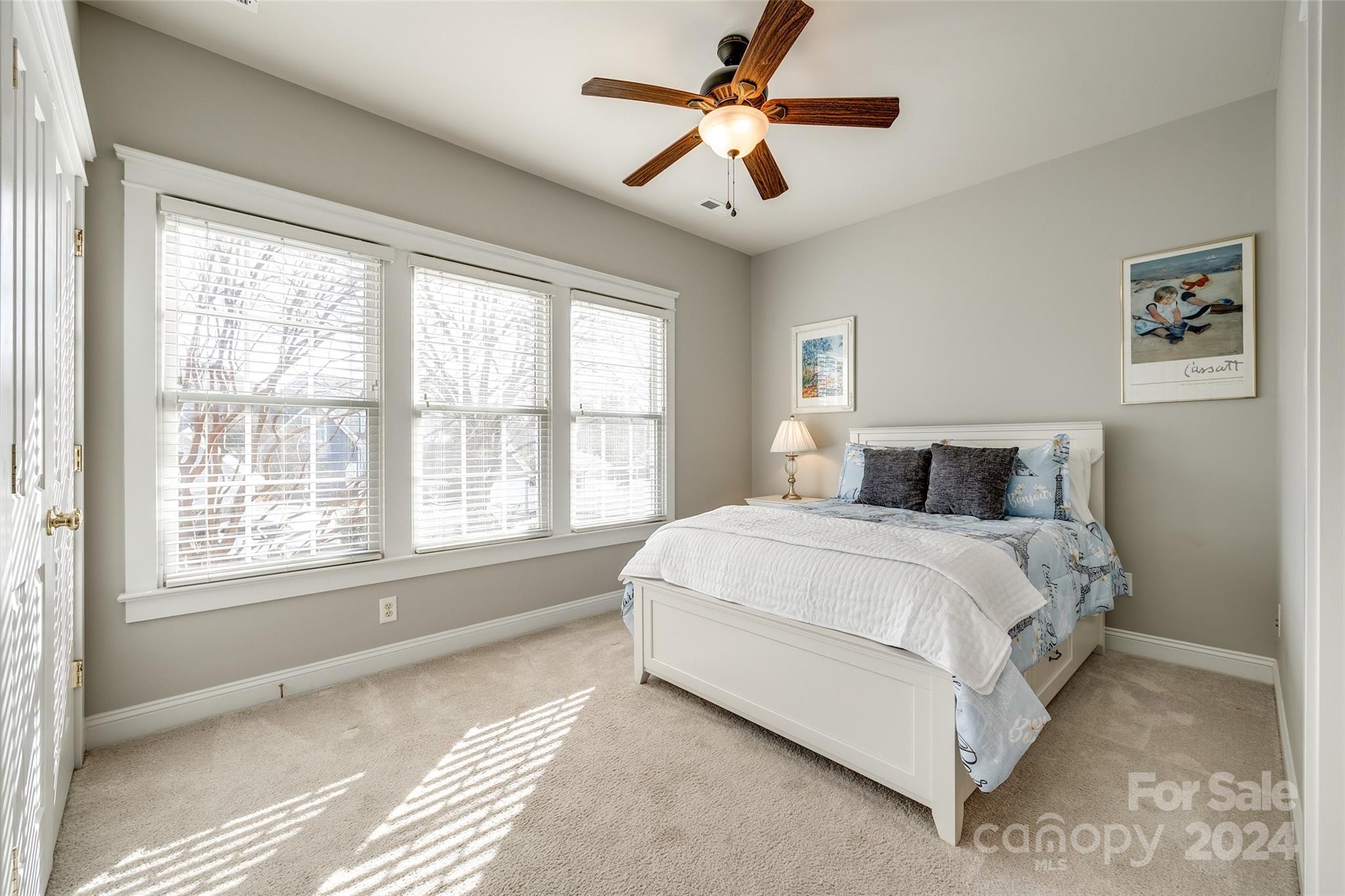 308 Elis Way Fort Mill, SC 29708 - Photo 16 of 29 a bedroom with a large bed and a large window