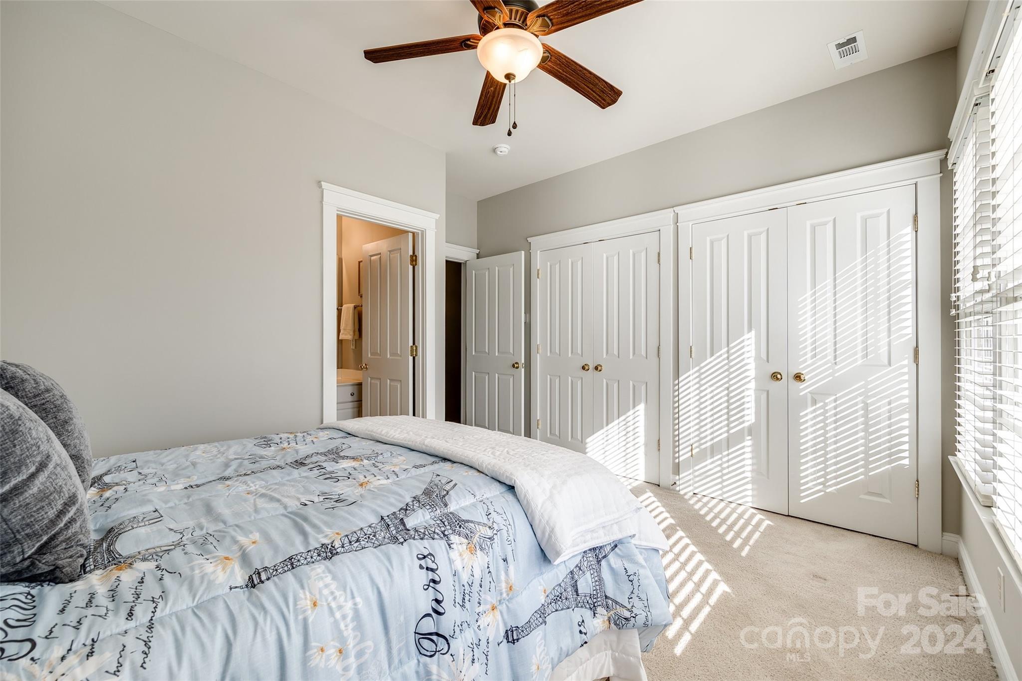 308 Elis Way Fort Mill, SC 29708 - Photo 17 of 29 a bedroom with a bed and a chandelier