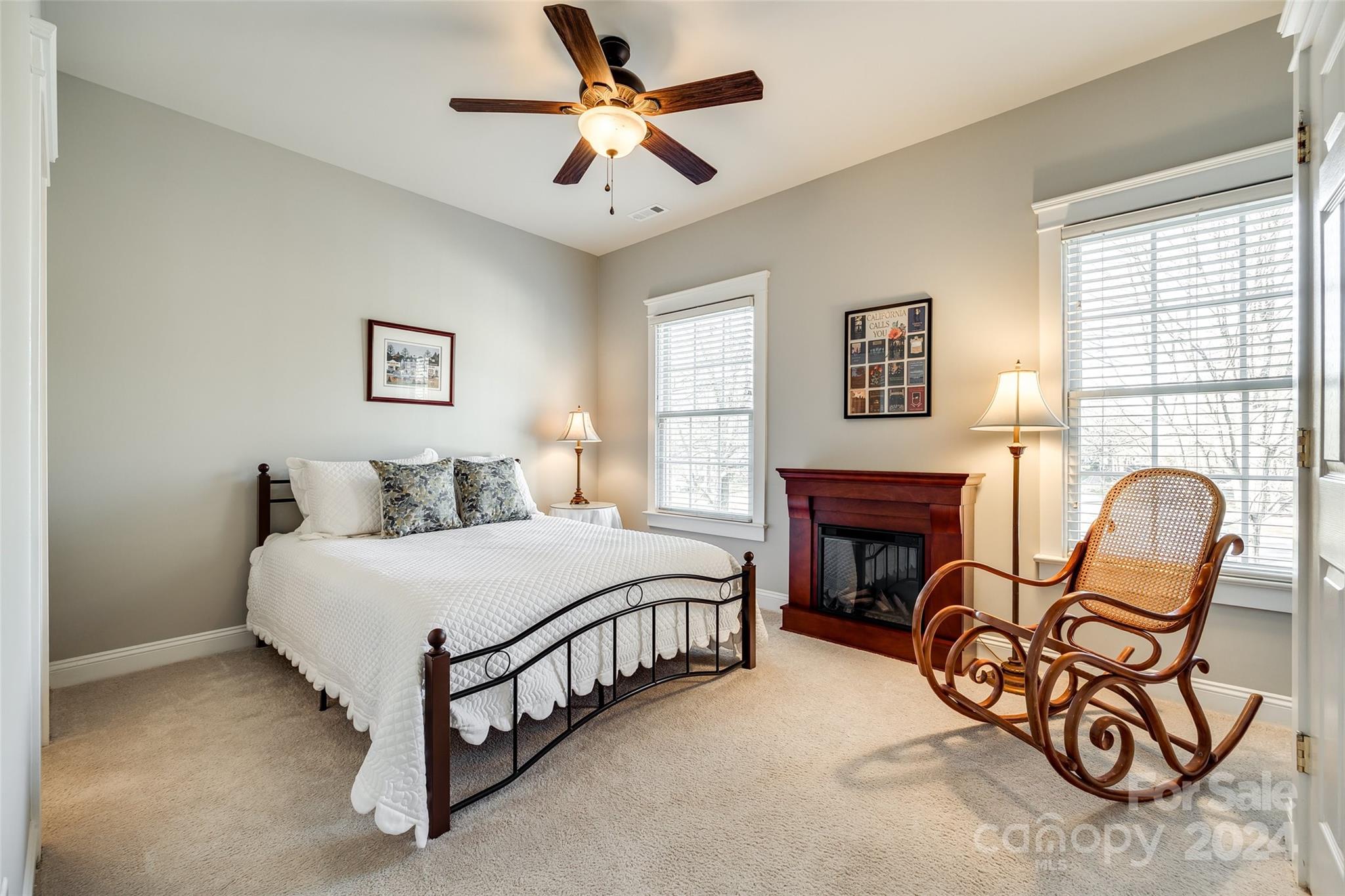 308 Elis Way Fort Mill, SC 29708 - Photo 19 of 29 a spacious bedroom with a bed a couch and a table