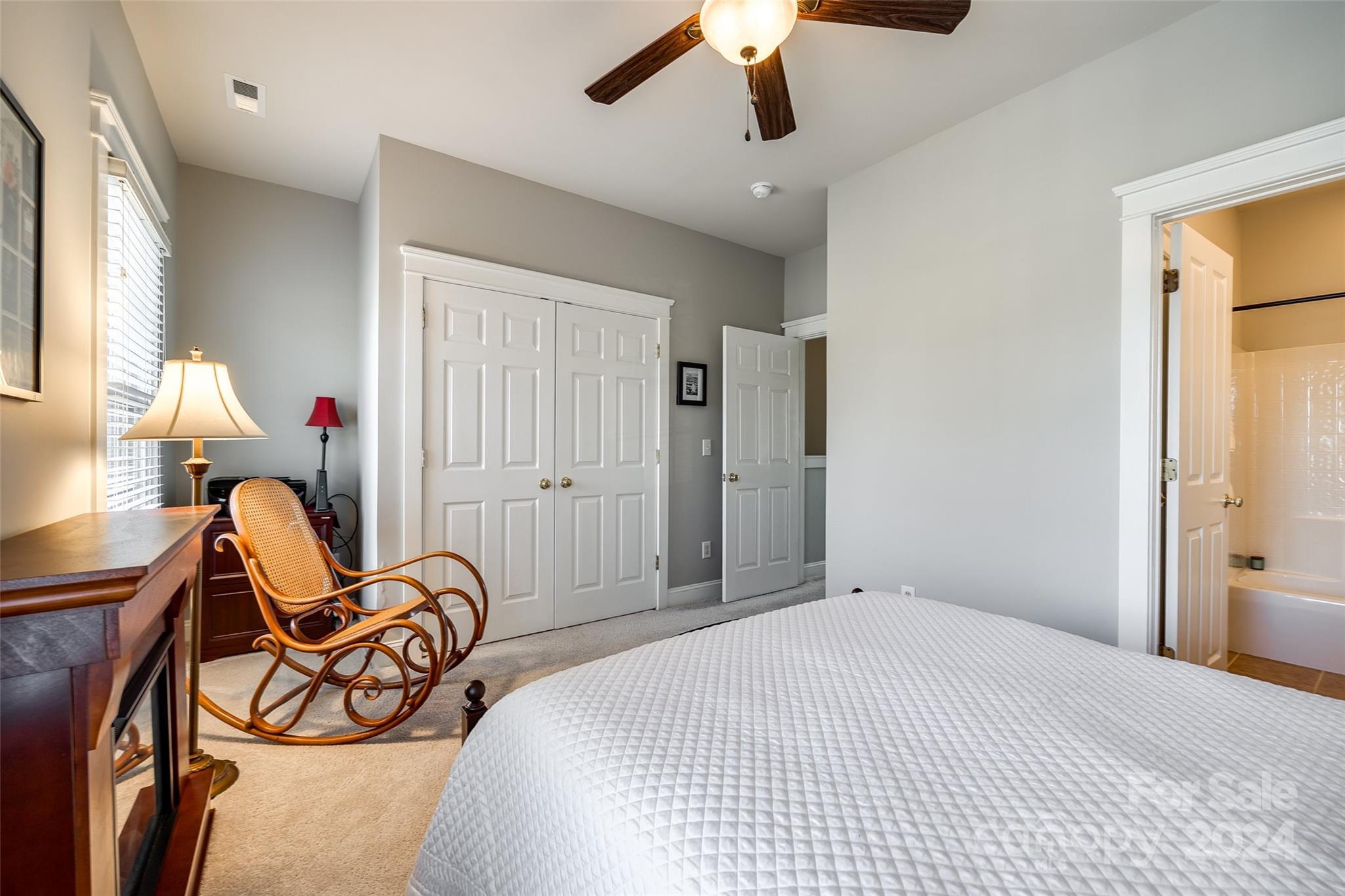 308 Elis Way Fort Mill, SC 29708 - Photo 20 of 29 a bedroom with a bed and a chandelier