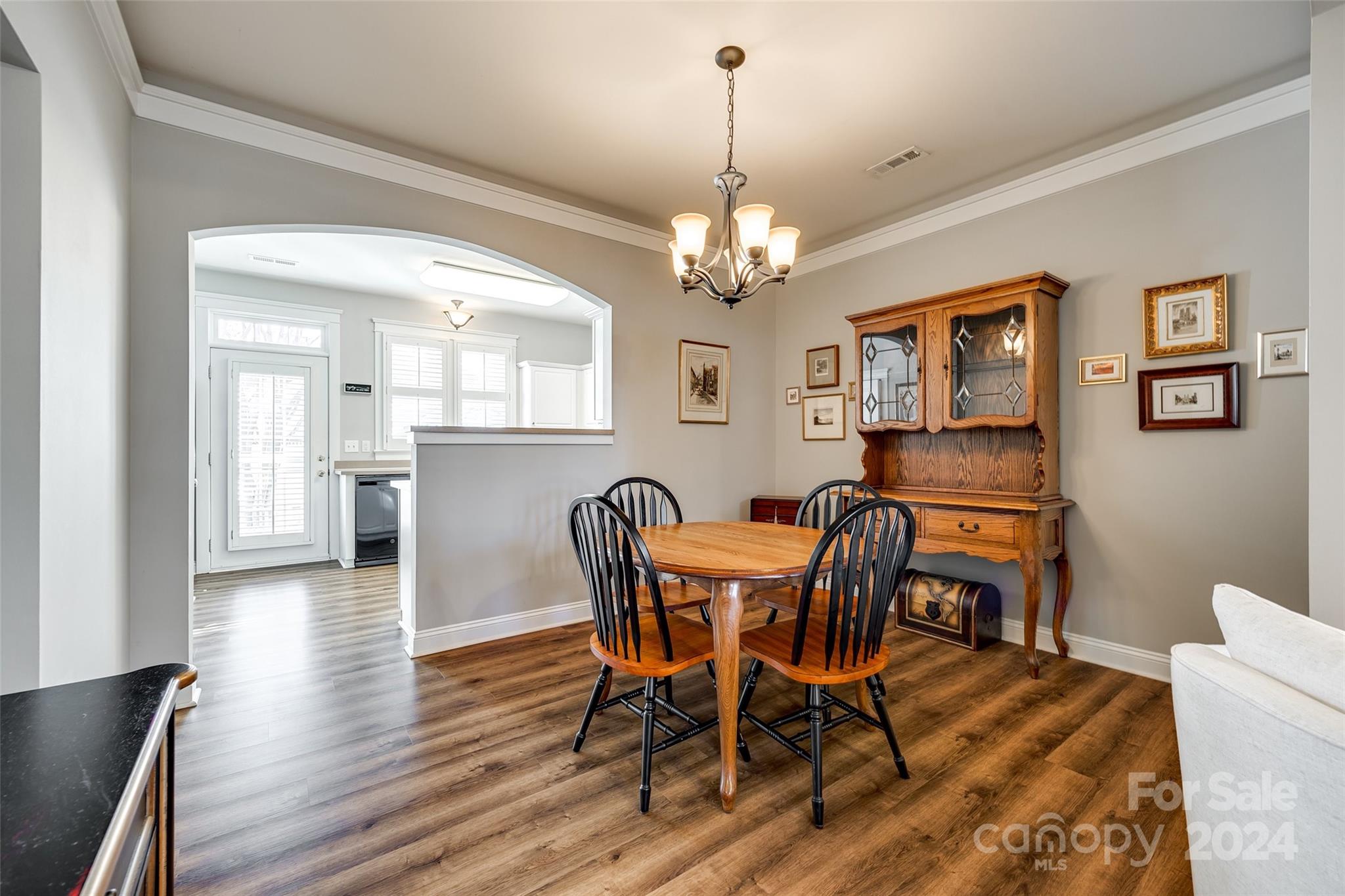 308 Elis Way Fort Mill, SC 29708 - Photo 7 of 29 a view of a dining room with furniture wooden floor and chandelier