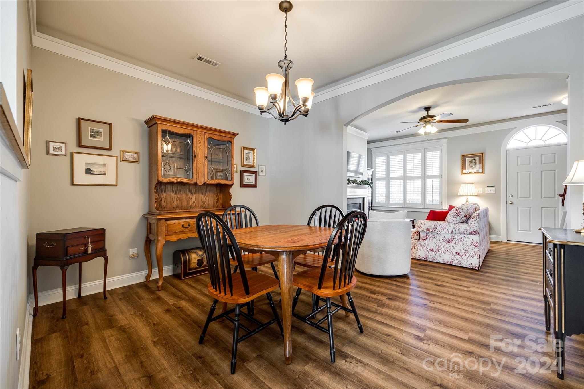 308 Elis Way Fort Mill, SC 29708 - Photo 9 of 29 a view of a dining room with furniture a chandelier and wooden floor