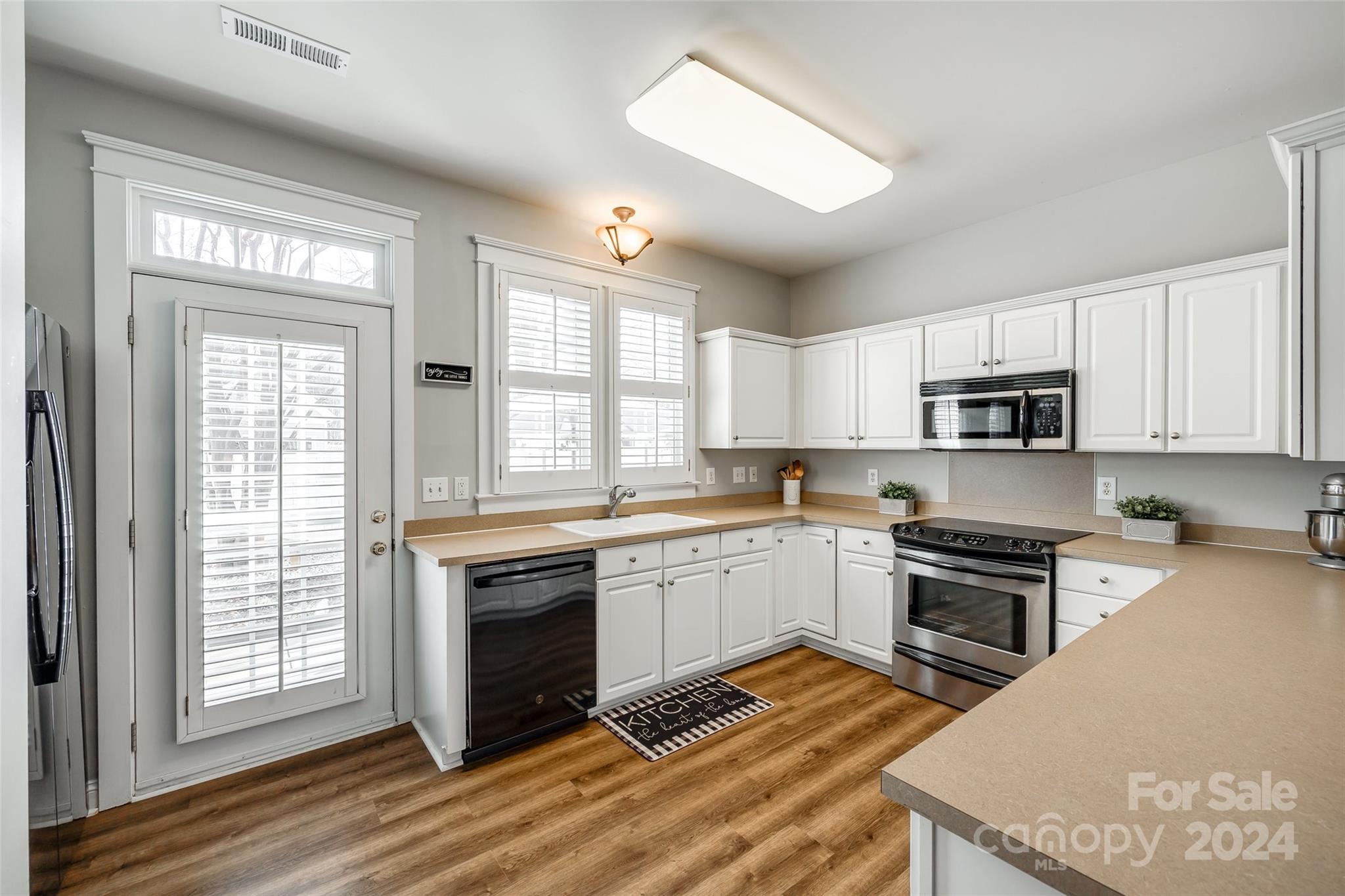 308 Elis Way Fort Mill, SC 29708 - Photo 10 of 29 a kitchen with granite countertop stainless steel appliances a stove sink and microwave