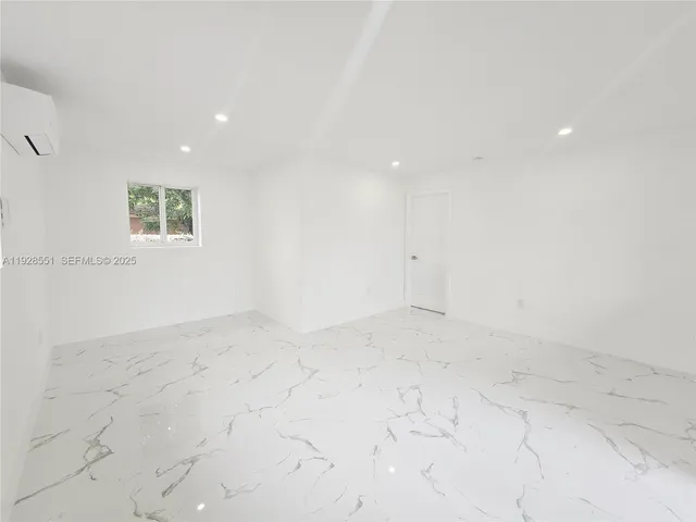 a bathroom with a toilet a sink and shower